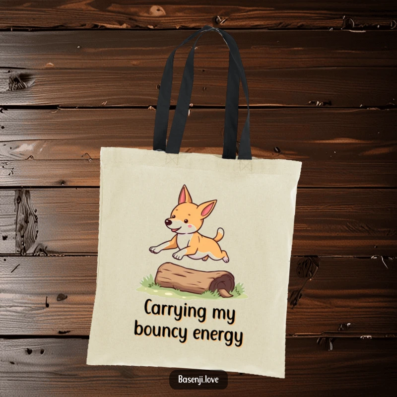Funny Basenji tote bag with a dog energetically leaping over a log, perfect for carrying daily items.